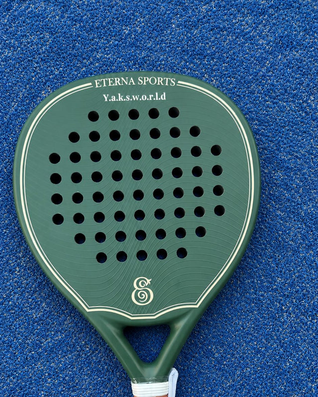 Bel Air Green Matte padel racket engraved with the owner's nickname on the Crown, on a blue court