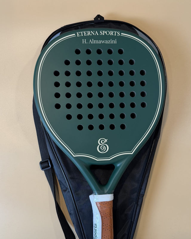 Bel Air Green Matte padel racket engraved with the owner's name on the Crown, resting on its cover