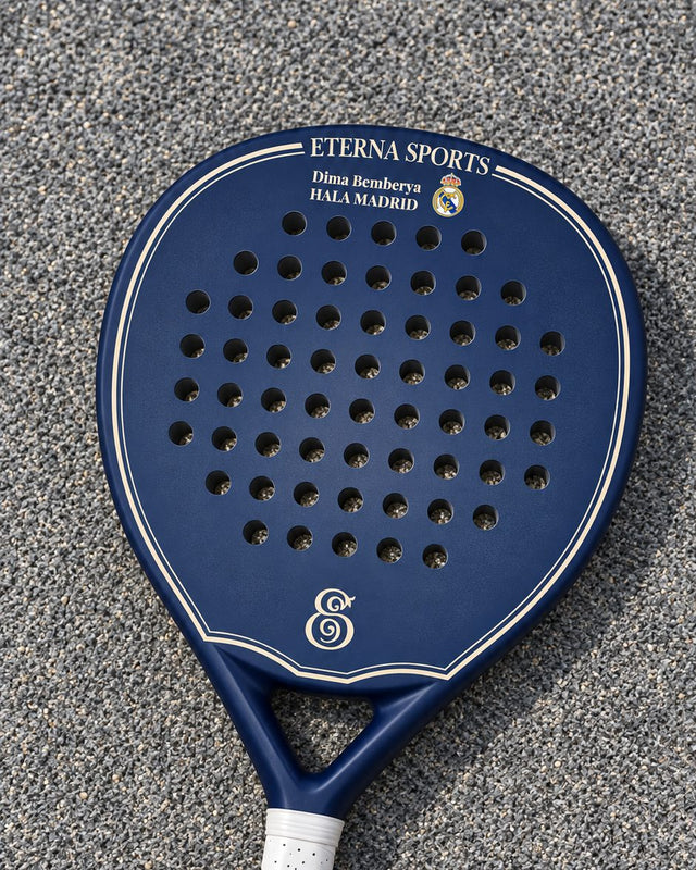 Soho Blue Matte padel racket engraved with the owner's name and a football club message with its crest on the Crown, on a grey court
