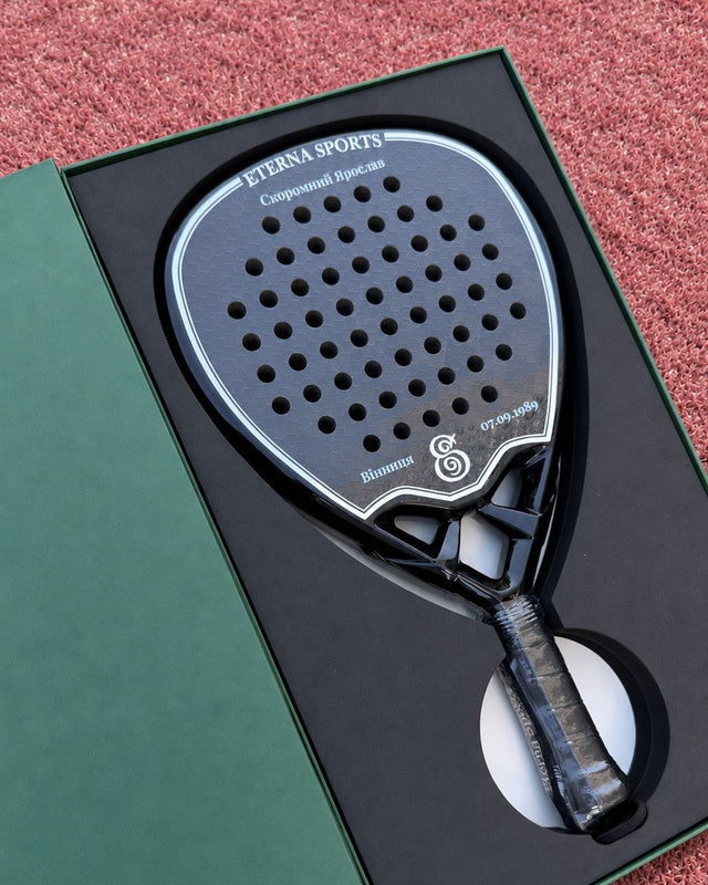 Tribeca Laser Black padel racket engraved with the owner's name on the Crown, presented in its gift box