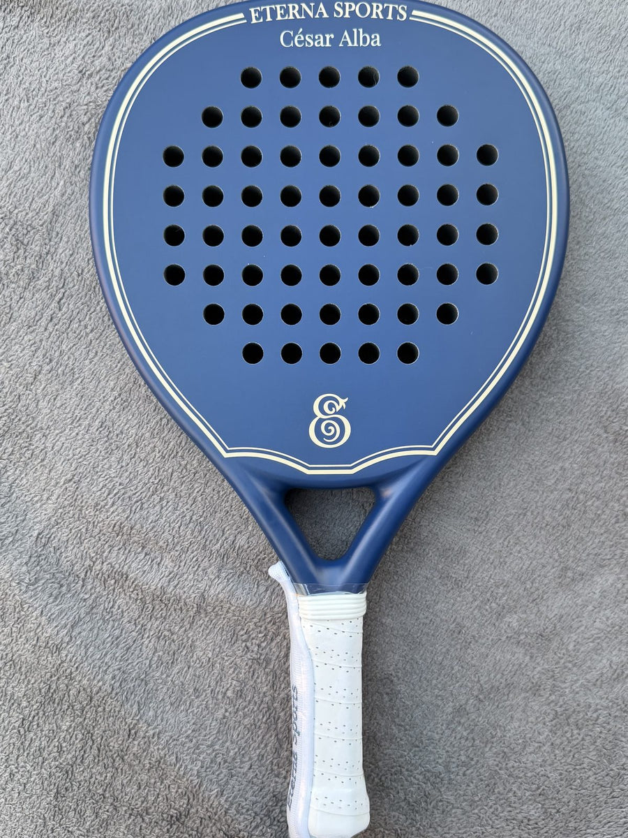 Blue Eterna Sports racket with the owner's name engraved above the face