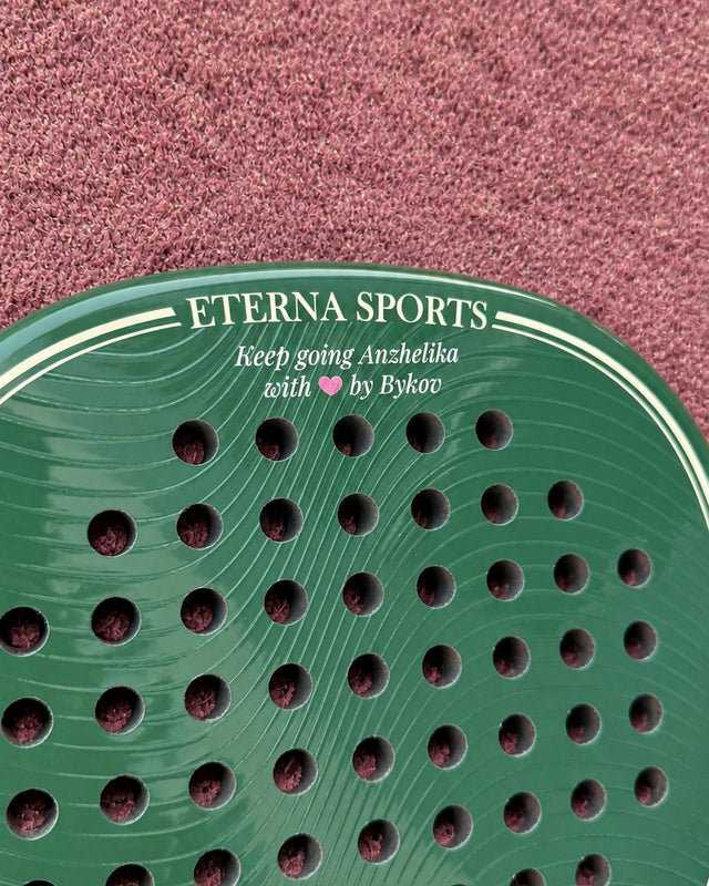 Bel Air Green Glossy padel racket engraved with a personal message on the Crown, close-up on court
