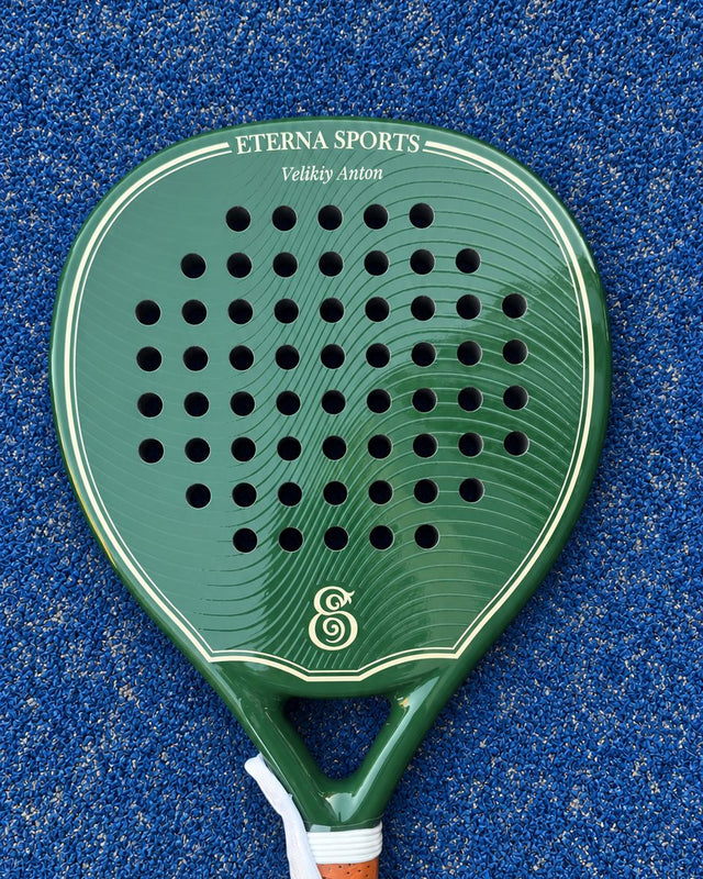 Bel Air Green Glossy padel racket engraved with the owner's name on the Crown, on a blue court