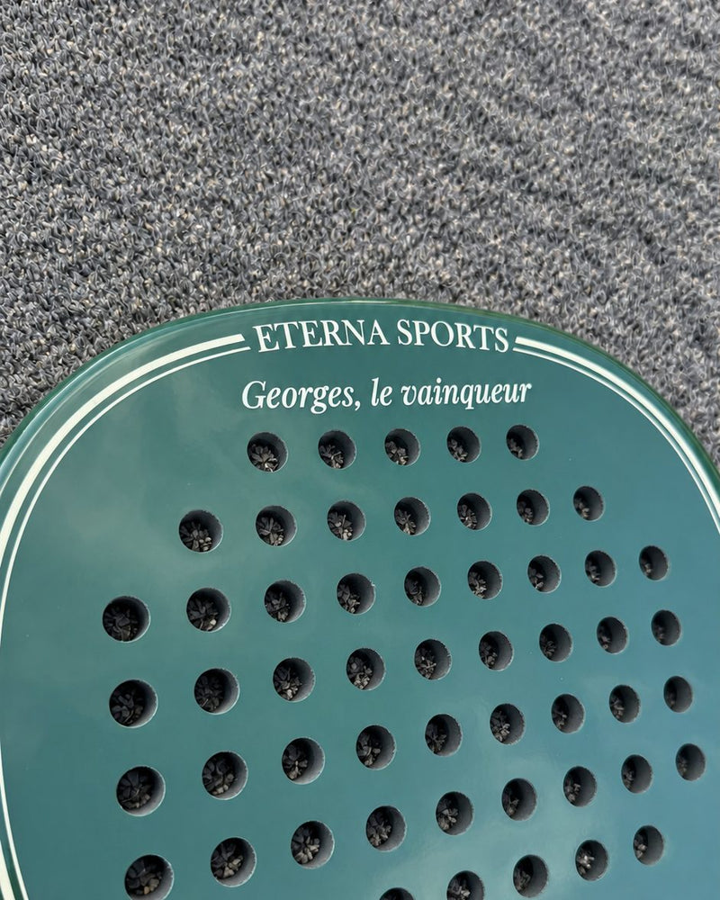 The finished laser engraving on the Crown of a Bel Air Green padel racket