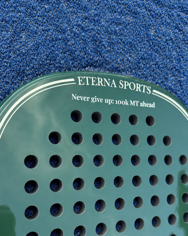 Bel Air Green Glossy padel racket engraved with a motivational message on the Crown, close-up