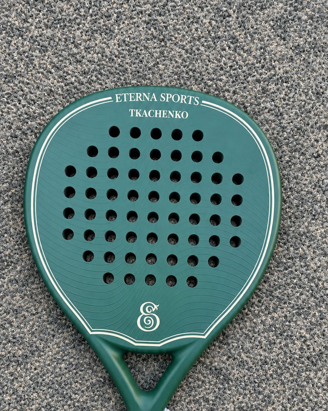Bel Air Green Matte padel racket engraved with the owner's surname on the Crown, on a grey court