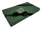 The Eterna gift box — hunter green with the monogram in cream, tied with a velvet ribbon