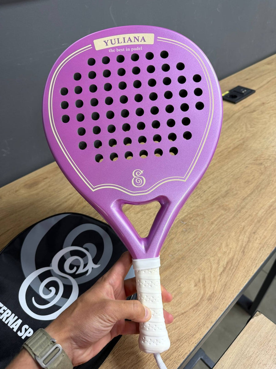 Purple Eterna Sports racket with the owner's name engraved, held up by its owner
