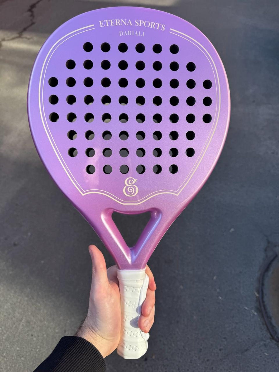 Purple Eterna Sports racket with the owner's name engraved, held up by its owner
